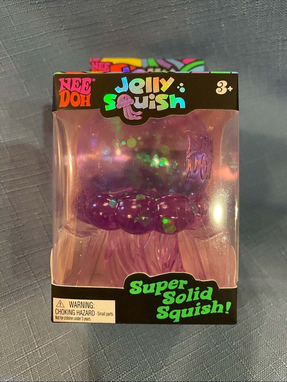 Viral Schylling NeeDoh JellySquish Purple Glitter Jellyfish Fidget Toy